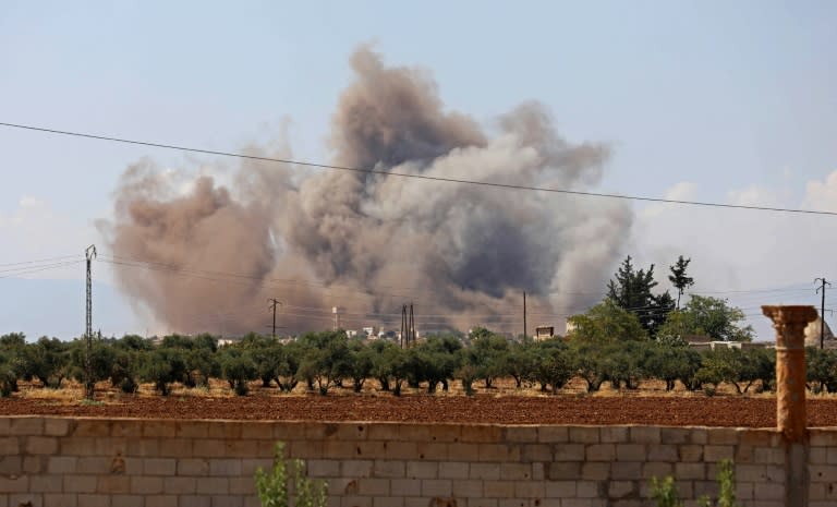 Smoke billows following a bombardment by Syrian government forces around the town of Khan Sheikhun on the southern edges of the rebel-held Idlib province on September 8, 2018