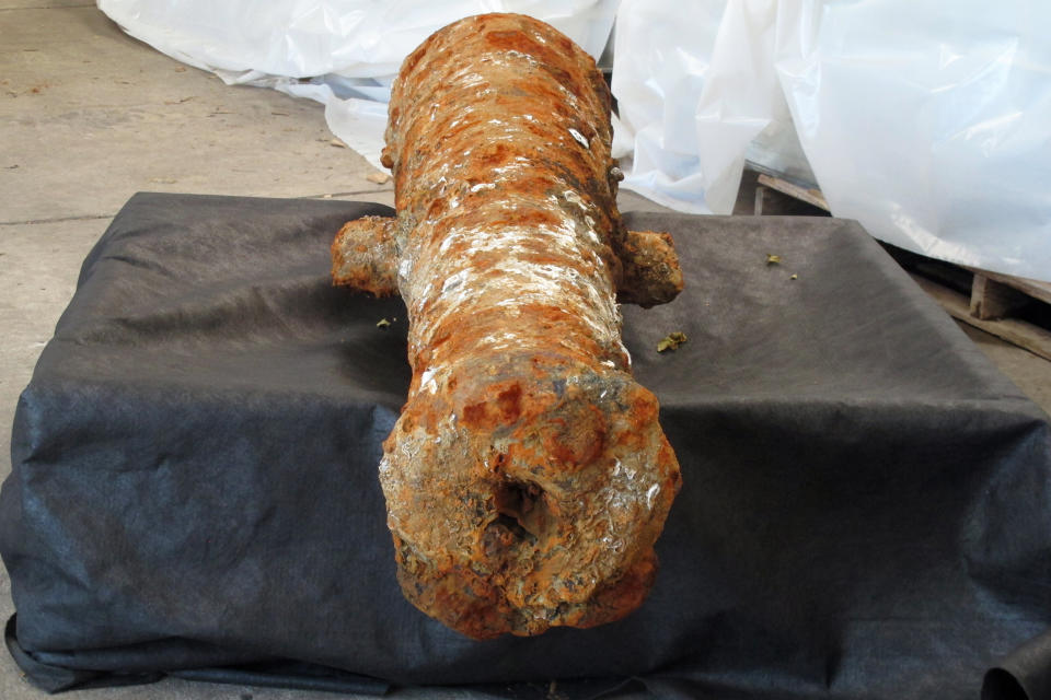 A cannon encrusted in rust and mud sits inside a warehouse operated by the Army Corps of Engineers in Savannah, Ga., on Thursday, April 28, 2022. It’s one of 19 cannons discovered in the Savannah River since last year that experts believe date to the American Revolution, when British ships were scuttled in the river to block colonists’ allies from reaching Savannah by ship.(AP Photo/Russ Bynum)