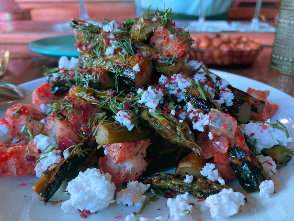 Grilled asparagus with ezme, feta and za'atar croutons at Honey Road in Burlington on May 29, 2024.