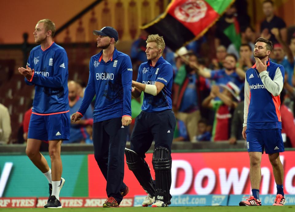 England players Stuart Broad (L),  Alex Hales (2nd L), Joe Root (2nd R) and James Anderson applaud following their victory against Afghanistan during the 2015 Cricket World Cup Pool A match between England and Afghanistan at the Sydney Cricket Ground on March 13, 2015. AFP PHOTO/ Saeed KHAN --IMAGE RESTRICTED TO EDITORIAL USE - STRICTLY NO COMMERCIAL USE--        (Photo credit should read SAEED KHAN/AFP/Getty Images)