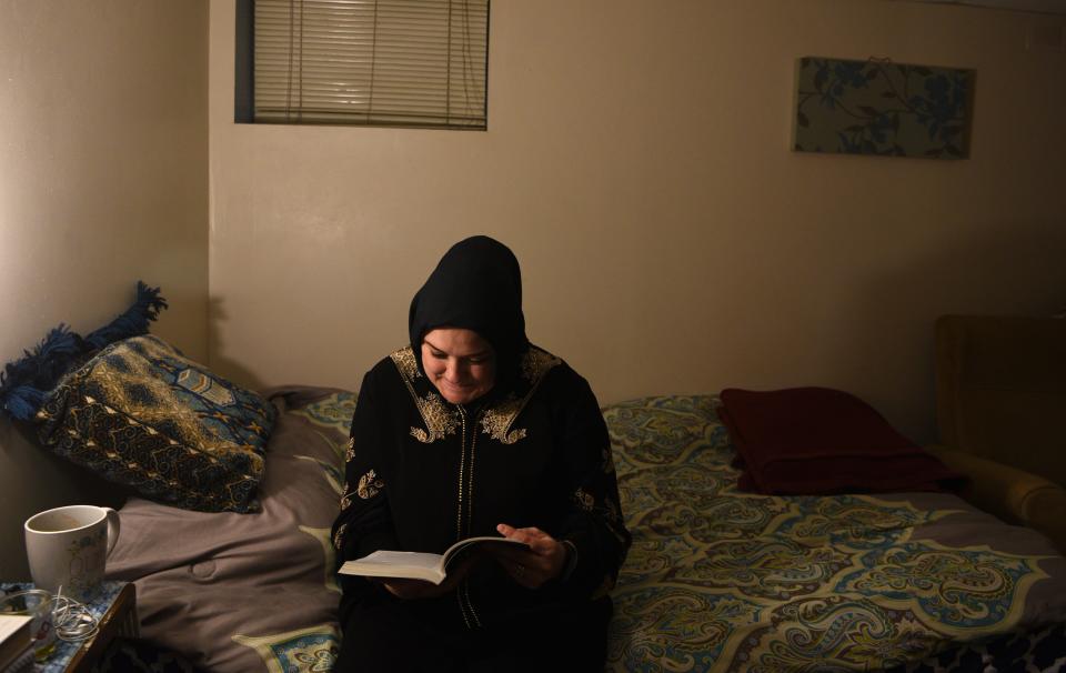 Khadijah Noor Tanju reads from "El Corán," a Spanish translation of the Quran, after saying Maghrib, evening prayers, at her Hackensack home on November 22, 2019. Raised Catholic, Tanju, a Latina, converted to Islam in June 2015.