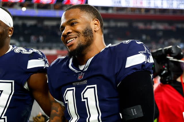 Kevin Sabitus/Getty Dallas Cowboys' Micah Parsons beams as he greets teammates on the football field