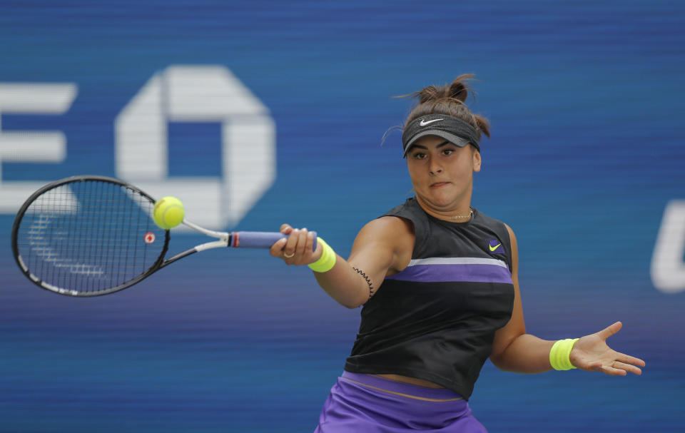 Bianca Andreescu, of Canada, returns a shot to Caroline Wozniacki, of Denmark, during round three of the US Open tennis championships Saturday, Aug. 31, 2019, in New York. (AP Photo/Eduardo Munoz Alvarez)