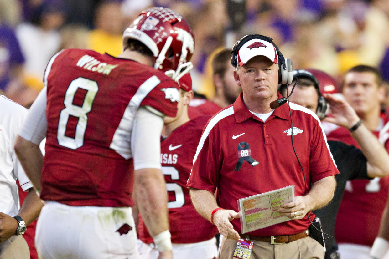 BATON ROUGE, LA - NOVEMBER 25:   Head Coach Bobby Petrino and Quarterback Tyler Wilson #8 of the Arkansas Razorbacks on the sidelines during a timeout against the LSU TIgers at Tiger Stadium on November 25, 2011 in Baton Rouge, Louisiana.  The Tigers defeated the Razorbacks 41 to 17.  (Photo by Wesley Hitt/Getty Images)