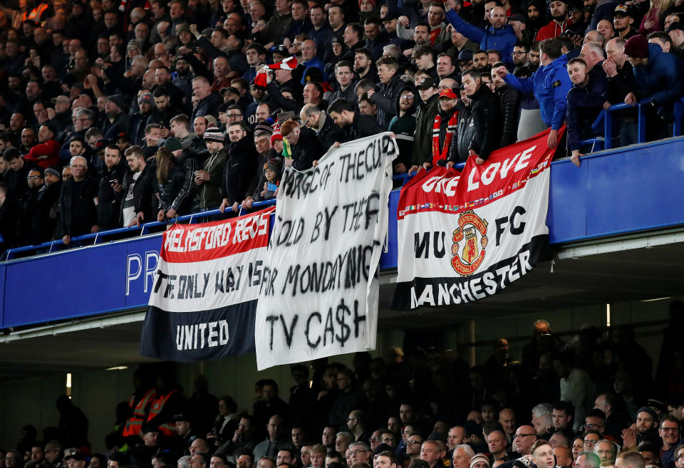 Soccer Football - FA Cup Fifth Round - Chelsea v Manchester United - Stamford Bridge, London, Britain - February 18, 2019  Manchester United fans display a banner in reference to the match being scheduled for a Monday  REUTERS/David Klein