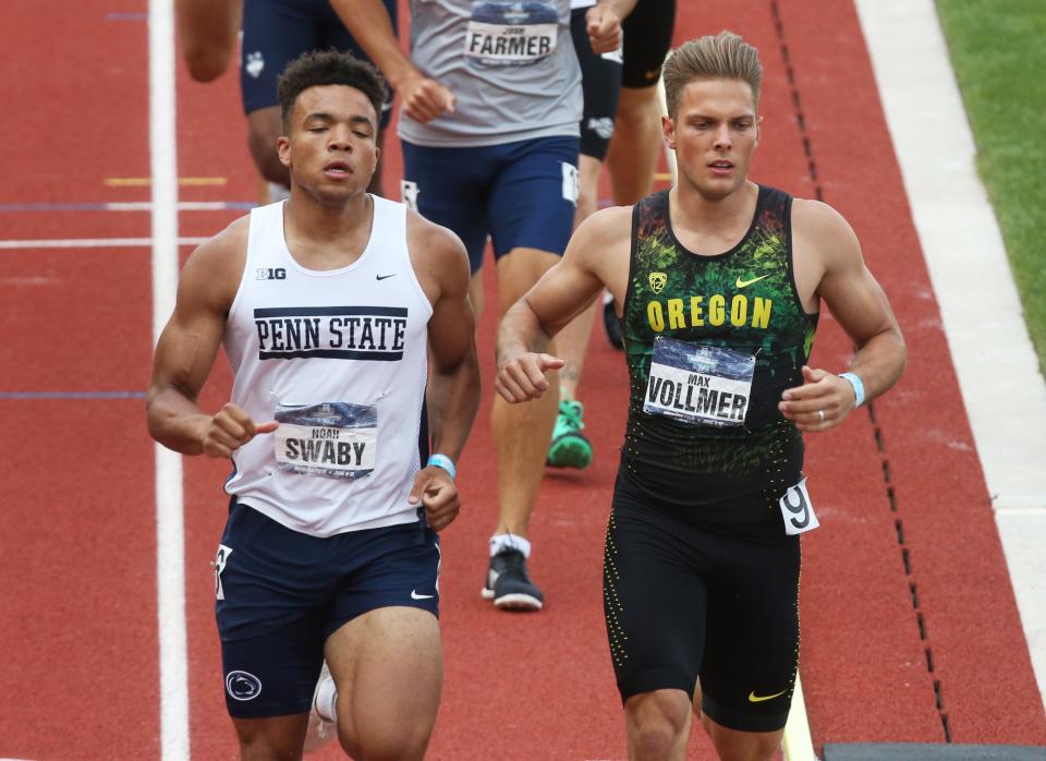 Oregon's Max Vollmer, right, competes in the last event of the decathlon, the 1,500 meters, at the NCAA Track & Field Championships.