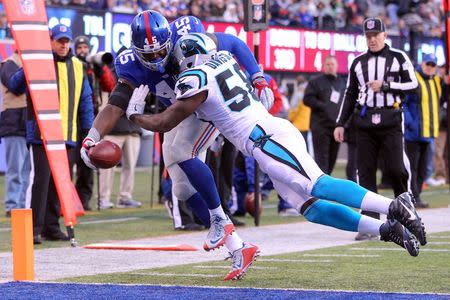 Dec 20, 2015; East Rutherford, NJ, USA; New York Giants tight end Will Tye (45) scores a touchdown against Carolina Panthers linebacker Thomas Davis (58) during the third quarter at MetLife Stadium. Mandatory Credit: Brad Penner-USA TODAY Sports