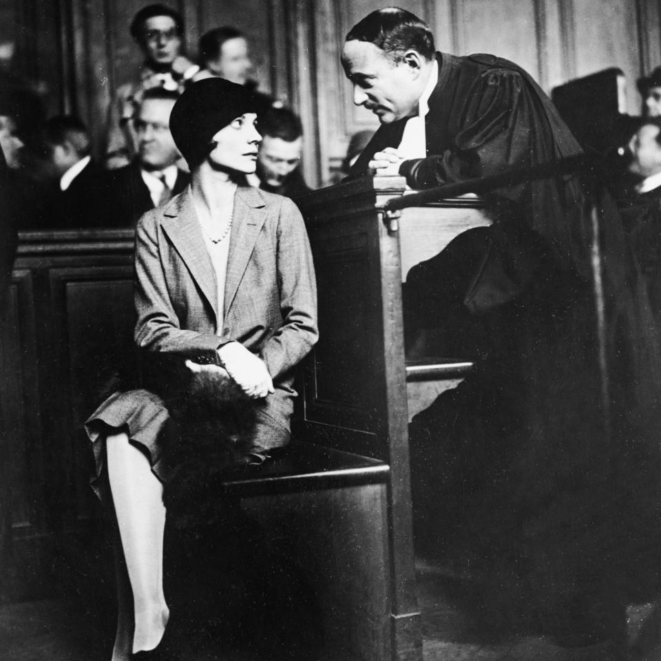 Alice de Janzé, on trial for the shooting of Raymond Trafford (whom she later married), consulting with her barrister - Bettmann