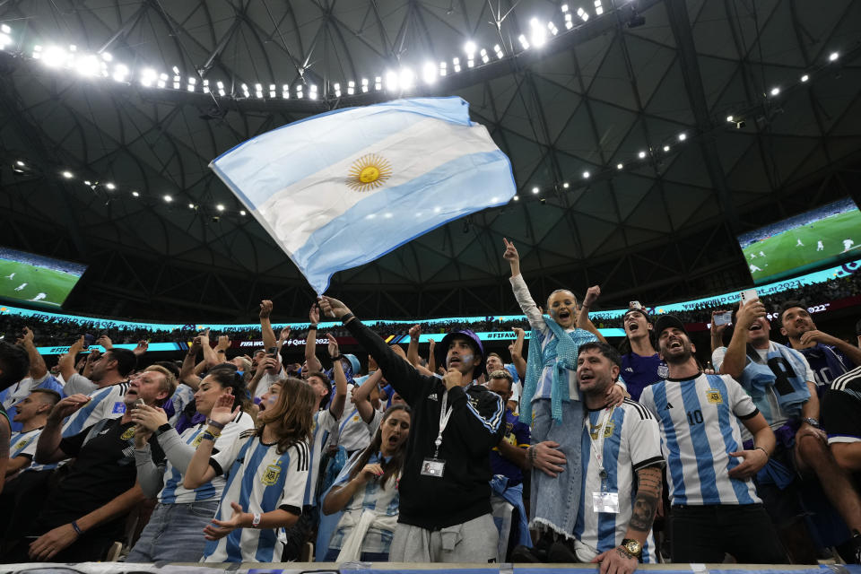 Argentinian fans cheer before the World Cup semifinal soccer match between Argentina and Croatia at the Lusail Stadium in Lusail, Qatar, Tuesday, Dec. 13, 2022. (AP Photo/Manu Fernandez)