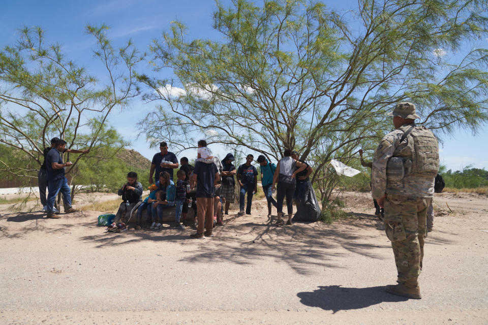 A group of migrants waits to be processed by U.S. Border Patrol after illegally crossing into Eagle Pass, Texas U.S. from Mexico on Tuesday July 26, 2022. / Credit: Allison Dinner/Anadolu Agency via Getty Images