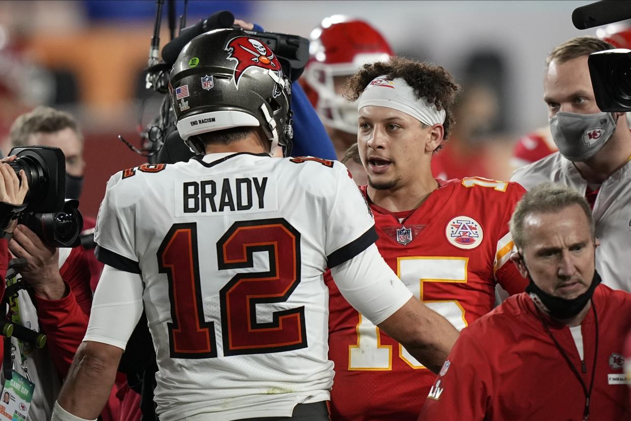 Tampa Bay Buccaneers quarterback Tom Brady, speaks with Kansas City Chiefs quarterback Patrick Mahomes after the NFL Super Bowl 55 football game, Sunday, Feb. 7, 2021, in Tampa, Fla. The Buccaneers defeated the Chiefs 31-9 to win the Super Bowl. (AP Photo/David J. Phillip)