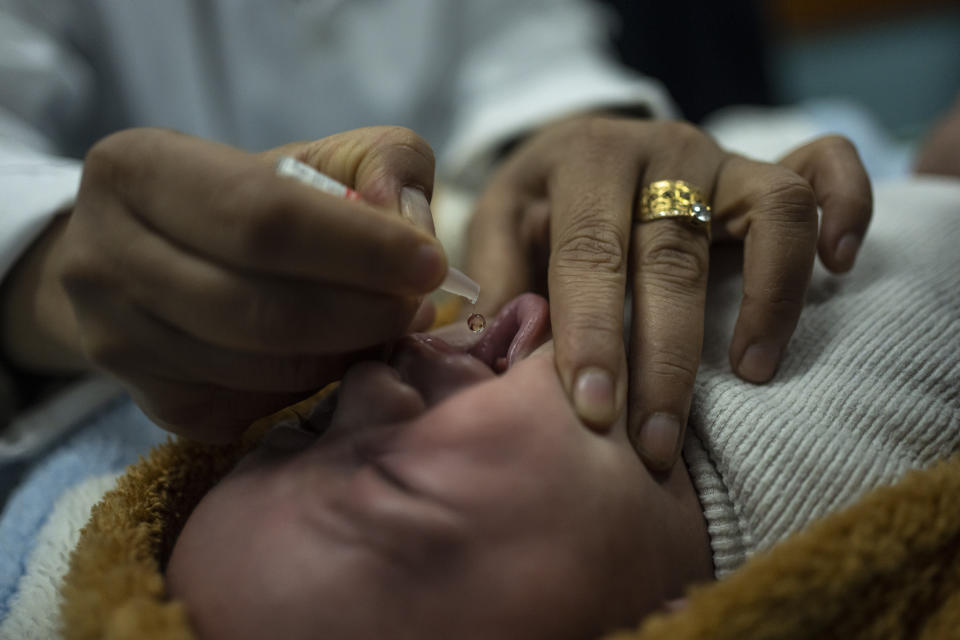 Palestinian children receive pentavalent vaccines in Rafah, Gaza Strip, Tuesday, Jan. 2, 2024. The vaccines, which protect against five diseases, recently entered Gaza in an international aid shipment and due to the ongoing war, most children are several months late for their immunizations. (AP Photo/Fatima Shbair)