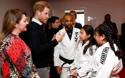 The Duke of Sussex speak to participants during a Jiu-jitsu session - Credit: Chris Jackson