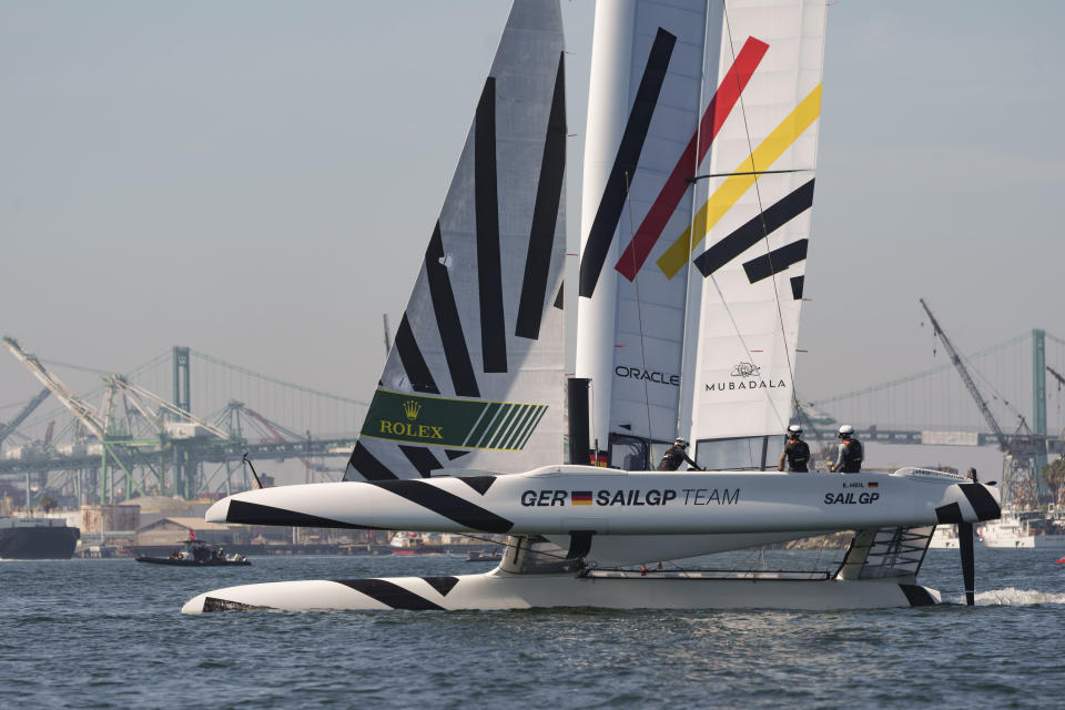 Team Germany's F50 takes part in a practice race for the Los Angeles Sail Grand Prix, Friday, July 21, 2023, at the Port of Los Angeles. SailGP has often billed itself as being Formula One on the water because it has the fastest boats and top skippers in the sport. That analogy has come full circle because retired F1 driver Sebastian Vettel is co-owner of the Germany SailGP Team, which is making its debut in Season 4 of tech baron Larry Ellison's global league. (AP Photo/Damian Dovarganes)