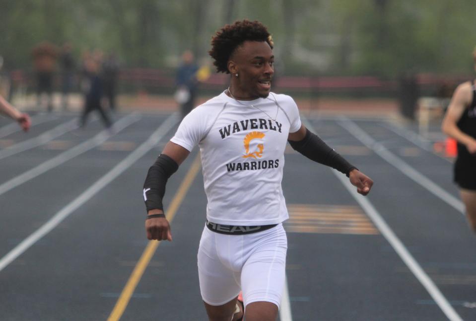 Evan Walker of Lansing Waverly wins the 400-meter run in the Division 1 track and field regional Friday, May 19, 2023 at Grand Ledge.