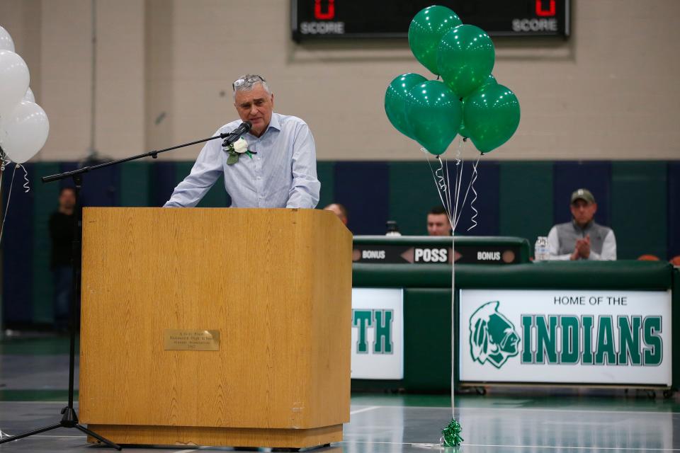 Coach Steve Gaspar speaks during the court dedication ceremony held in the Dartmouth High School gymnasium.  The basketball court was named in his name.