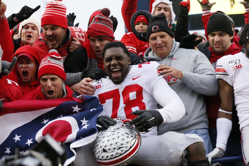 Ohio State tackle Nicholas Petit-Frere, here celebrating with fans after a win over Michigan in 2019, will serve as a public spokesman for a Tampa technology startup. Credit: USA TODAY Sports