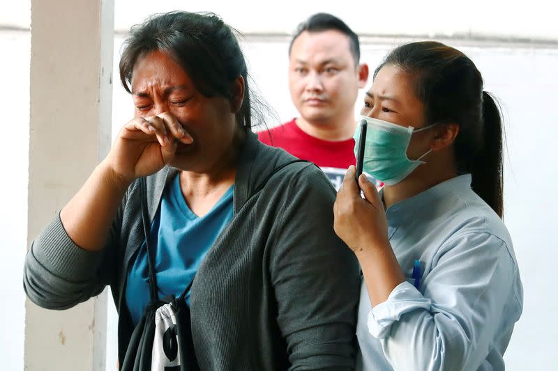 Victim's family members cry at a hospital following a gun battle involving a Thai soldier on a shooting rampage, in Nakhon Ratchasima