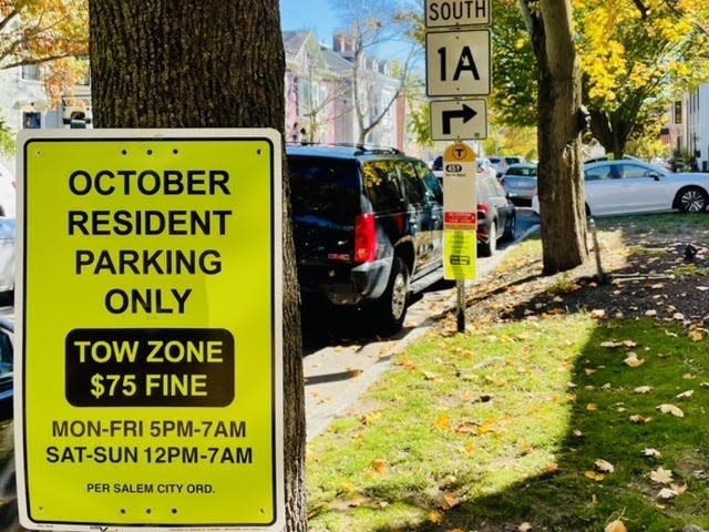 Photo on parking signs posted on Winter St. in salem massachusetts