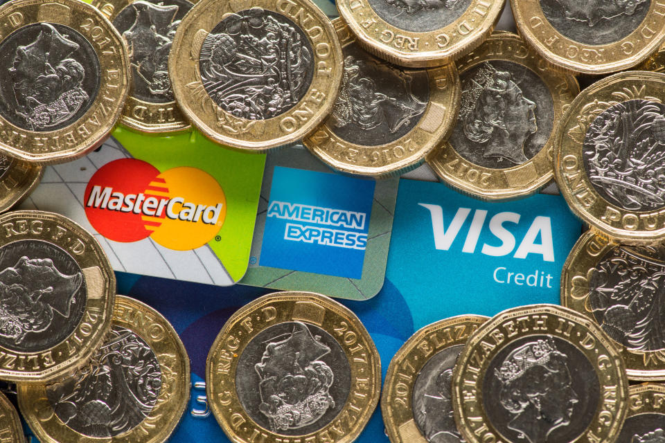 Mastercard, American Express and Visa credit cards with UK one pound coins. Photo: Dominic Lipinski/PA Images for Getty Images