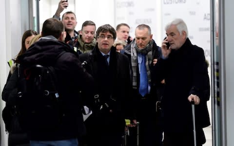 Catalan separatist leader Carles Puigdemont arrives at Copenhagen Airport with his team - Credit: REUTERS