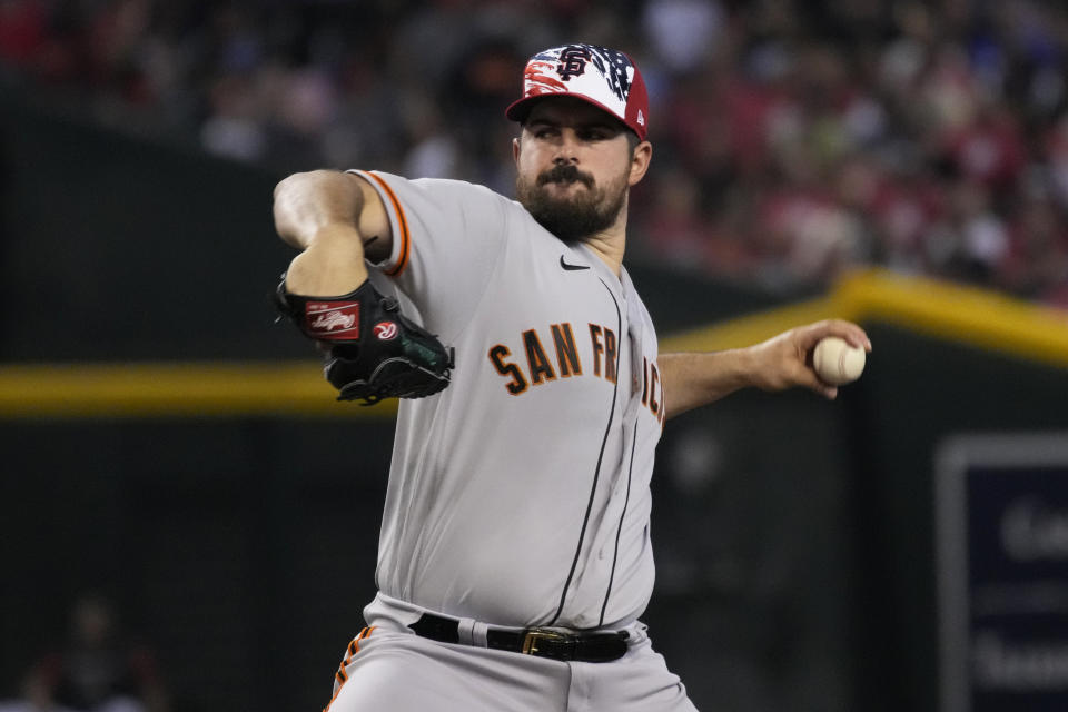 San Francisco Giants pitcher Carlos Rodon throws against the Arizona Diamondbacks in the first inning during a baseball game, Monday, July 4, 2022, in Phoenix. (AP Photo/Rick Scuteri)