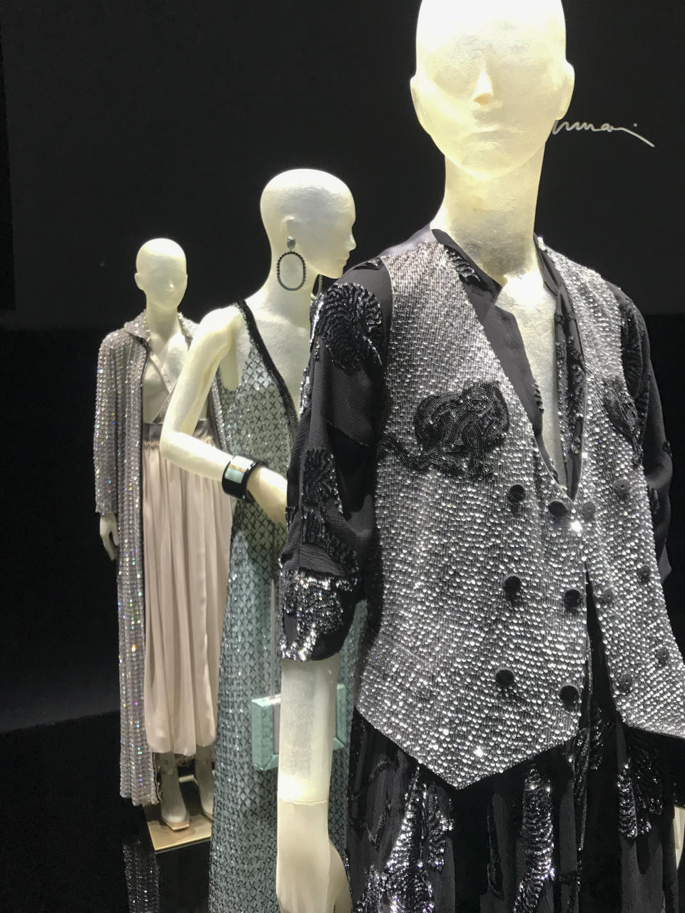 Creations displayed at a presentation as part of the Giorgio Armani 2021 women's spring-summer ready-to-wear collection during the fashion week in Milan, Italy, Saturday, Sept. 26, 2020. (AP Photo/Colleen Barry)