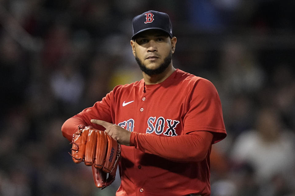 Boston Red Sox starting pitcher Eduardo Rodriguez gestures to the Houston Astros during the seventh inning in Game 3 of baseball's American League Championship Series Monday, Oct. 18, 2021, in Boston. (AP Photo/David J. Phillip)