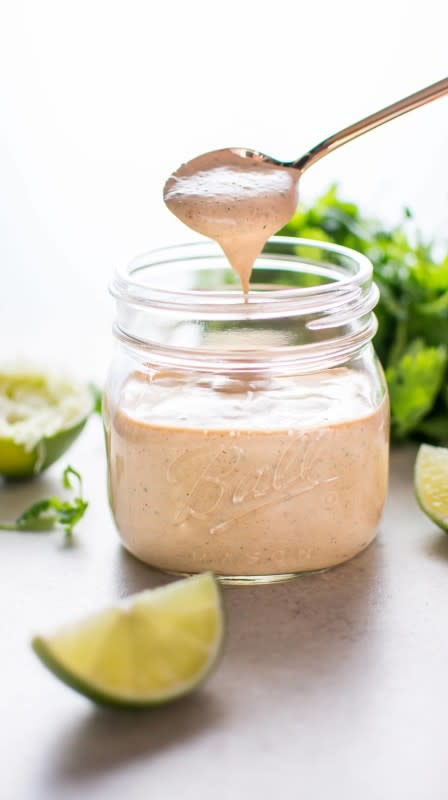 <p>Salt and Lavender</p><p>Chipotle lime ranch dressing is smoky, tangy and as spicy as you want it to be! This versatile southwest salad dressing is the ultimate topping for salads, tacos, wraps and so much more.</p><p><strong>Get the recipe: <a href="https://www.saltandlavender.com/chipotle-cilantro-lime-ranch-dressing/" rel="nofollow noopener" target="_blank" data-ylk="slk:Chipotle Lime Ranch Dressing;elm:context_link;itc:0;sec:content-canvas" class="link rapid-noclick-resp">Chipotle Lime Ranch Dressing</a></strong></p>