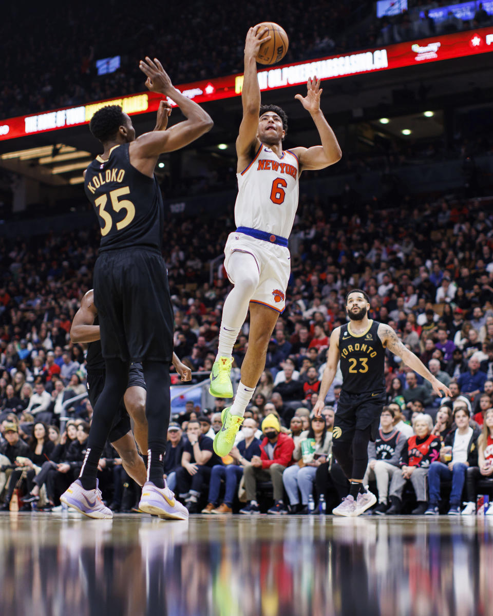 New York Knicks guard Quentin Grimes (6) drives to the net against Toronto Raptors center Christian Koloko (35) during the second half of an NBA basketball game Friday, Jan. 6, 2023, in Toronto. (Cole Burston/The Canadian Press via AP)