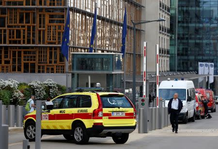 Emergency services vehicles are seen outside the European Union Council building after noxious gases were found in its kitchens in Brussels, Belgium October 13, 2017. REUTERS/Francois Lenoir