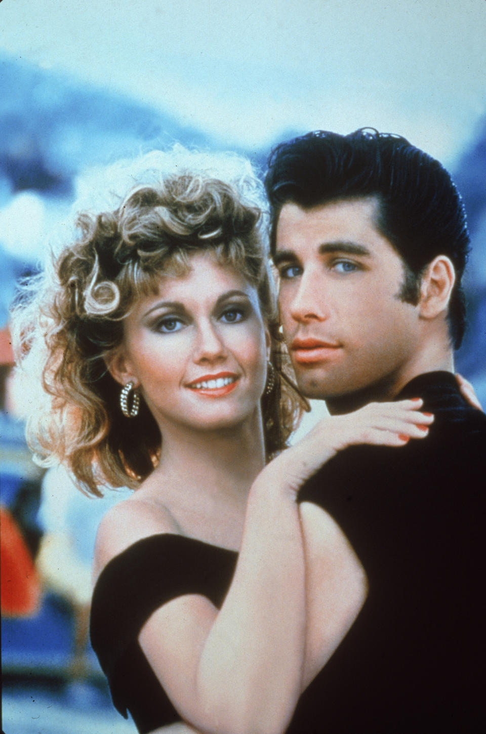 Actors John Travolta and Olivia Newton-John embrace in a promotional still for the film, 'Grease,' directed by Randal Kleiser, 1978. (Photo by Paramount Pictures/Fotos International/Getty Images) 