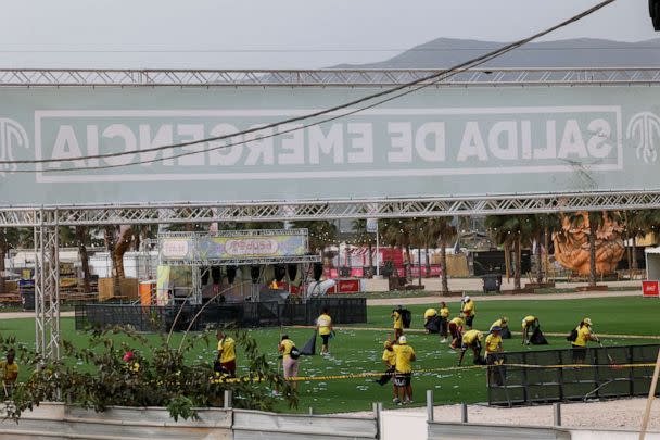 PHOTO: Staff members clean the venue of Medusa Festival, an electronic music festival, after high winds caused part of a stage to collapse, in Cullera, near Valencia, Spain, Aug. 13, 2022. (Eva Manez/Reuters)