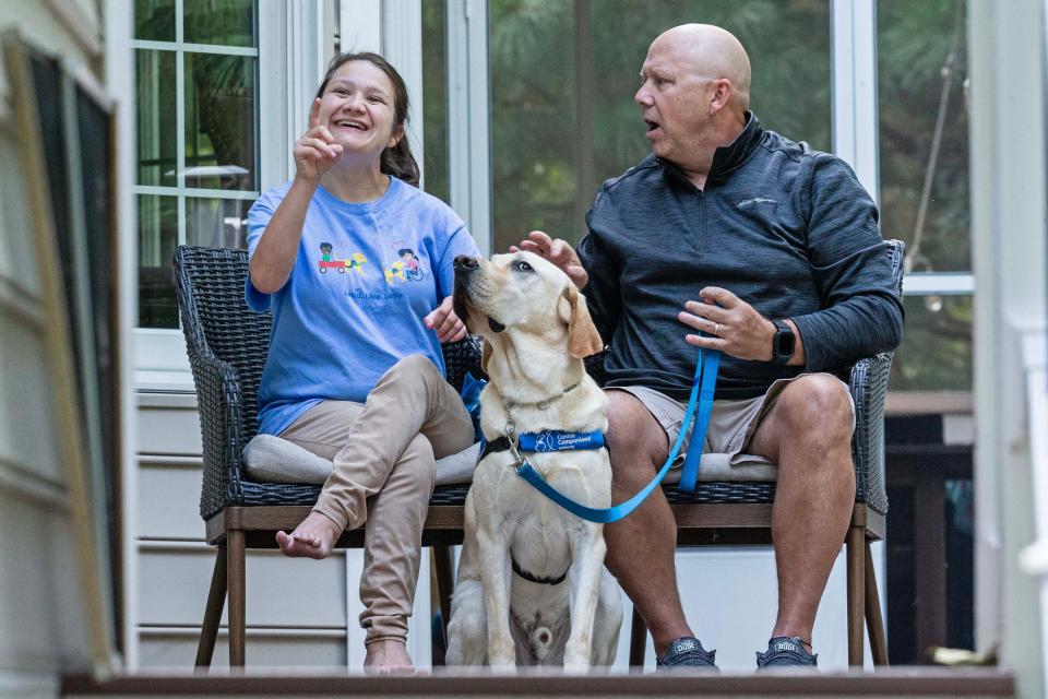 The TinsleyÕs, Jazmin and her dad Kevin, respond to interview questions regarding the importance of JazminÕs new service dog, Bonus, on the back porch of the Tinsley family home in Rehoboth Beach, Wednesday, Sept. 27, 2023. Jazmin dreams of being a teacher and living independently one day.