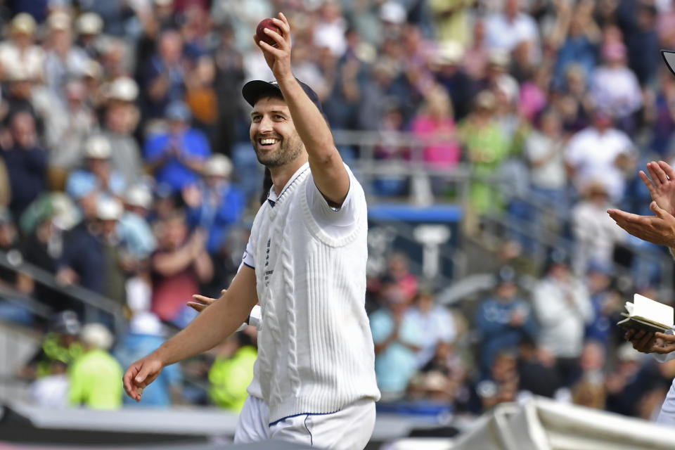 England's Mark Wood holds up the ball to celebrate his five-wicket haul during the first day of the third Ashes Test match between England and Australia at Headingley, Leeds, England, Thursday, July 6, 2023. (AP Photo/Rui Vieira)