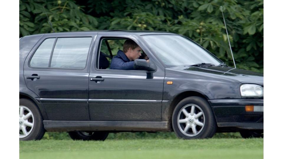 Prince William behind the wheel of his first car - a VW Golf