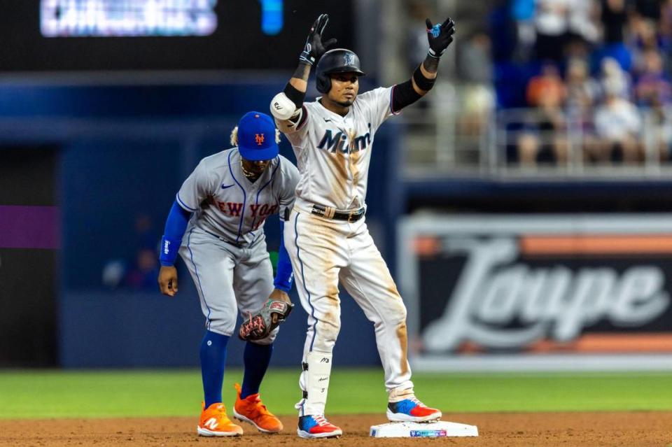 Miami Marlins base runner Luis Arraez (3) reacts to hitting a double during the sixth inning of an MLB game against the New York Mets at LoanDepot Park in Miami, Florida, on Thursday, March 30, 2023.