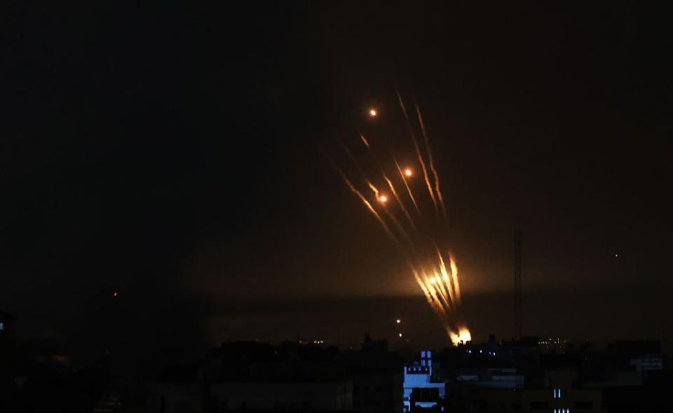 Palestinians fire rockets in response to Israeli airstrikes on the Gaza Strip on Sunday.