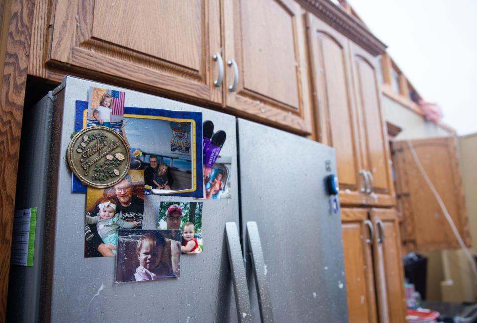 Water damaged pictures of Matt Ditmanson's family hang on his refrigerator after a devastating tornado hit Sioux Falls on Tuesday, Sept. 11, 2019. (Via OlyDrop)