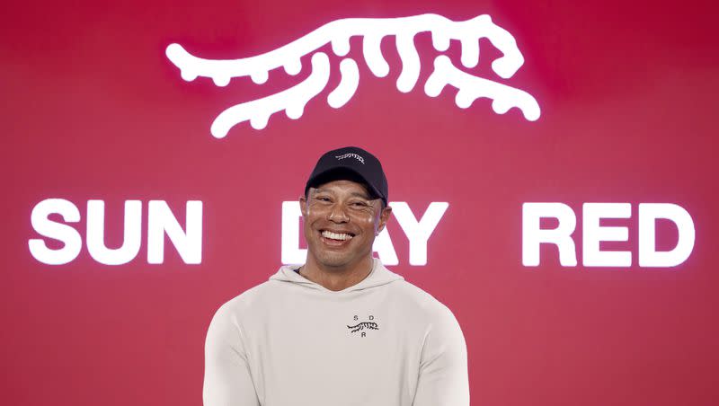 Tiger Woods reacts at a news conference ahead of the Genesis Open golf tournament, Monday, Feb. 12, 2024, in the Pacific Palisades area of Los Angeles.