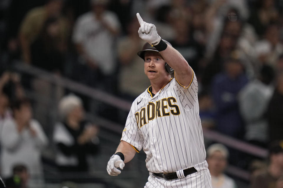 San Diego Padres' Garrett Cooper celebrates after hitting a two-run home run during the second inning of a baseball game against the Colorado Rockies, Monday, Sept. 18, 2023, in San Diego. (AP Photo/Gregory Bull)