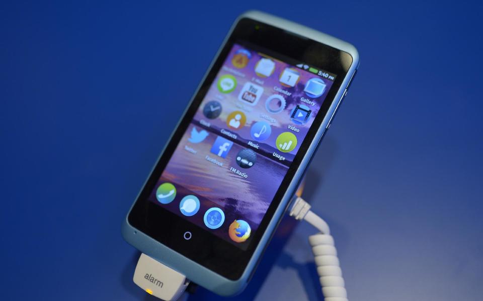 A device is running with Firefox OS software during the Mobile World Congress, the world's largest mobile phone trade show in Barcelona, Spain, Sunday, Feb. 23, 2014. Expected highlights include major product launches from Samsung and other phone makers, along with a keynote address by Facebook founder and chief executive Mark Zuckerberg. (AP Photo/Manu Fernandez)