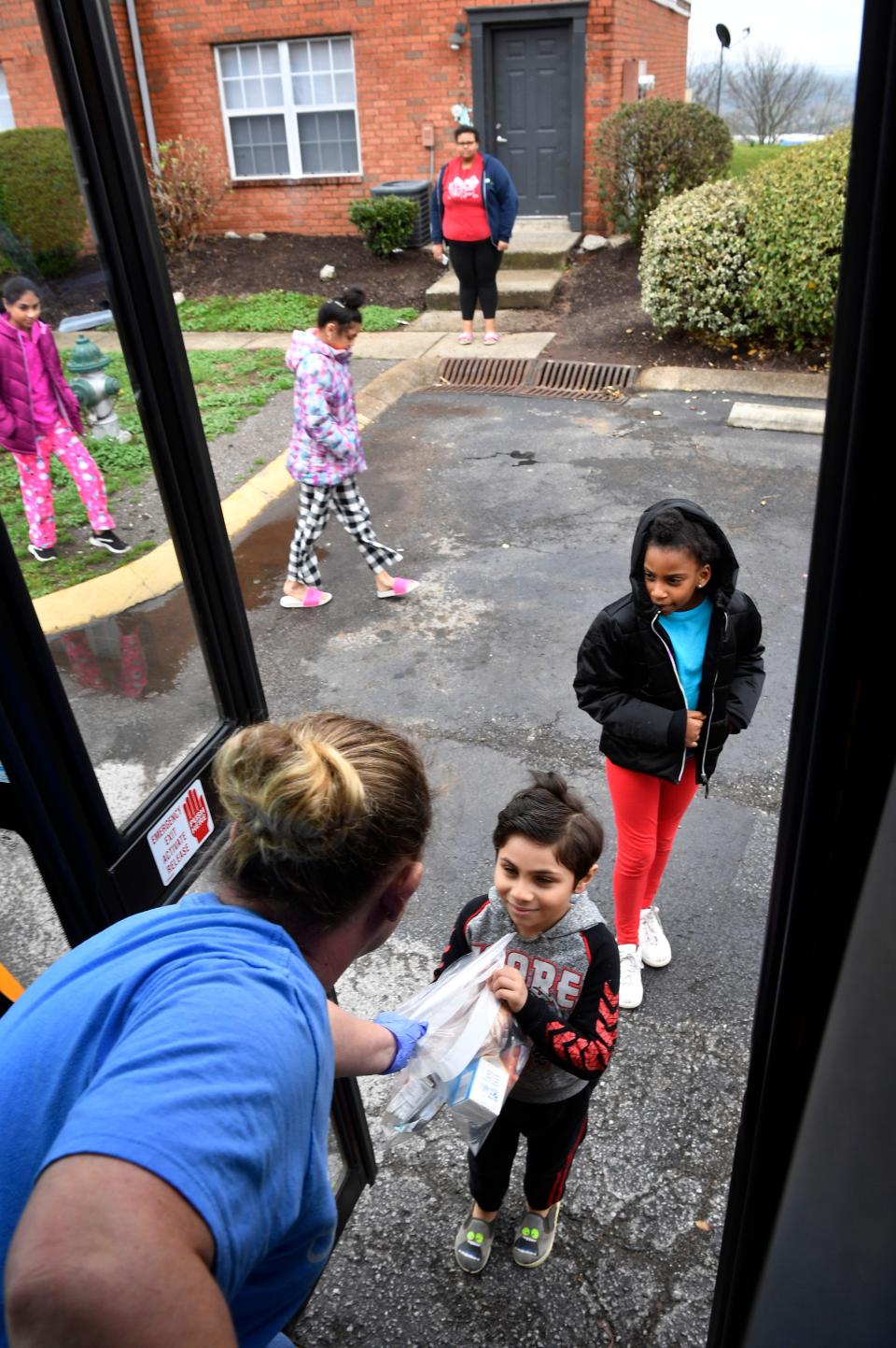 Tabatha Mainord hands both a breakfast and lunch bag to the “babies” that come to her bus during the meal delivery.Metro Nashville Public Schools will be delivering free breakfast and lunch meals to children in Nashville at locations throughout Davidson County on weekdays in Nashville, Tenn. Wednesday, March 25, 2020.