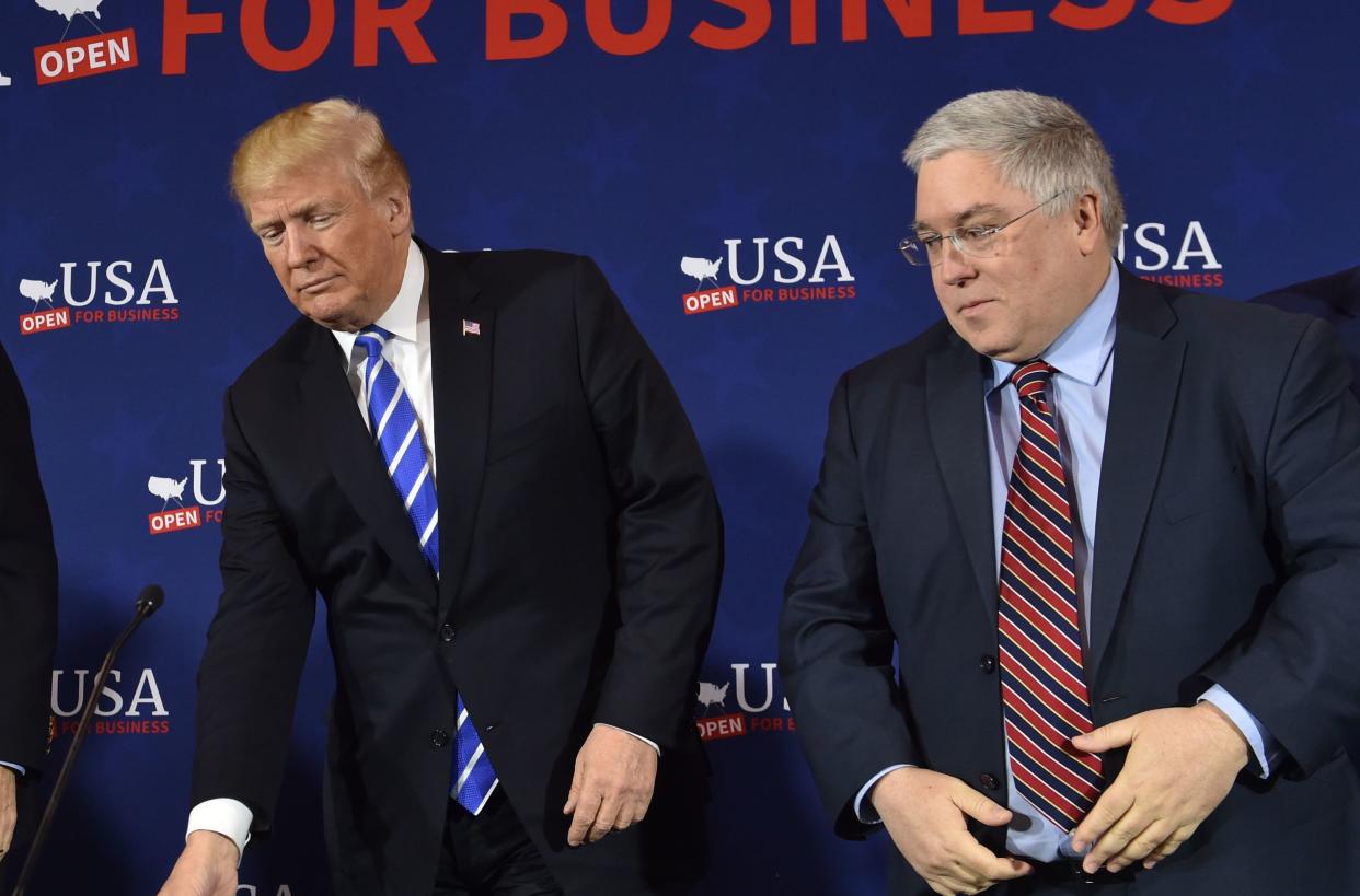 President Donald Trump arrives for a roundtable discussion on tax reform&nbsp;in White Sulpher Springs, West Virginia, on April 5. At right is West Virginia Attorney General Patrick Morrissey. (Photo: NICHOLAS KAMM/AFP via Getty Images)