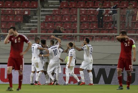 Greece's players celebrate their team's winning goal during their Euro 2016 group F qualifying soccer match against Hungary at the Karaiskakis stadium in Piraeus, near Athens, Greece, October 11, 2015. REUTERS/Alkis Konstantinidis