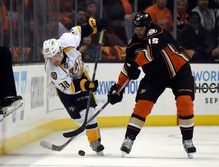 Anaheim Ducks center Ryan Getzlaf (15) and Nashville Predators right wing Viktor Arvidsson (38) battle for the puck in the first period in game seven of the first round of the 2016 Stanley Cup Playoffs at Honda Center. Mandatory Credit: Kirby Lee-USA TODAY Sports