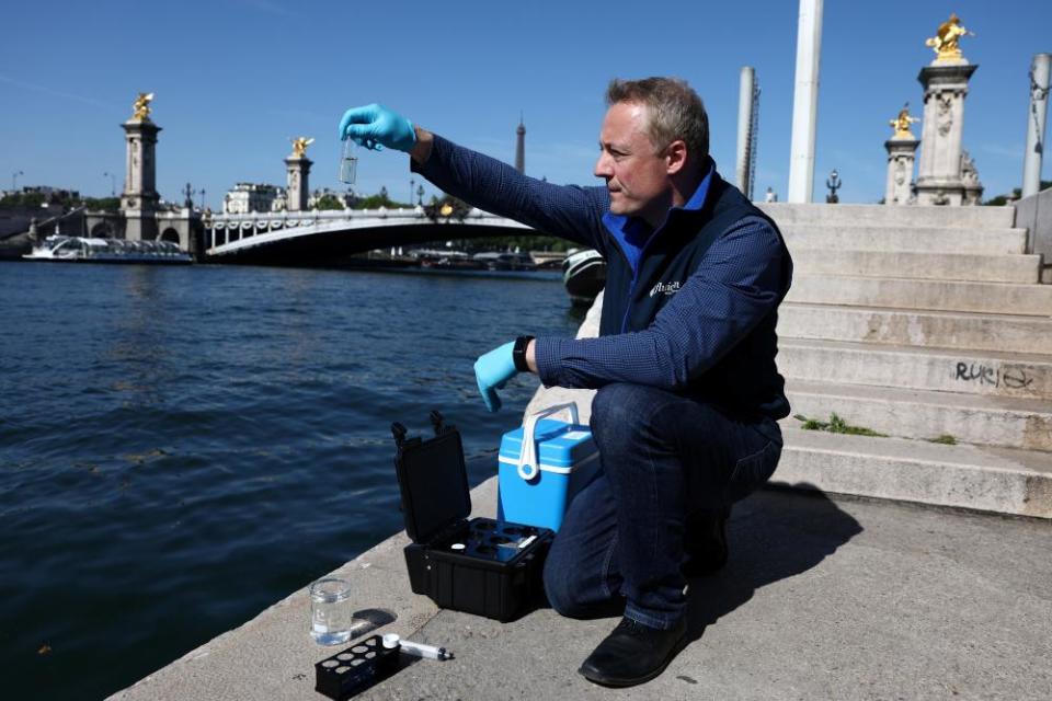 Dan Angelescu, CEO of the monitoring company Fluidion, testing the waters of the Seine in May this year.