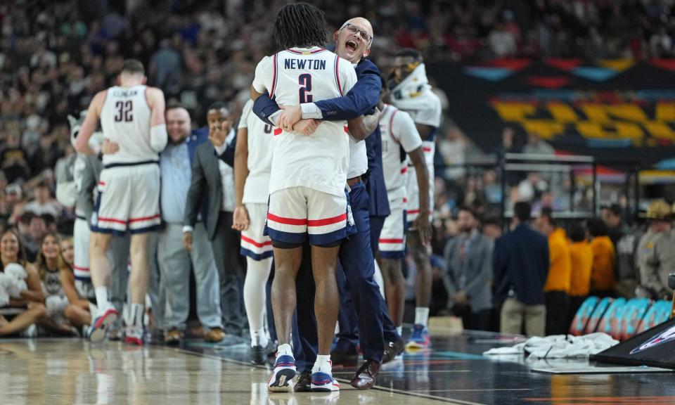 <span>Connecticut Huskies head coach Dan Hurley hugs guard <a class="link " href="https://sports.yahoo.com/ncaab/players/152771/" data-i13n="sec:content-canvas;subsec:anchor_text;elm:context_link" data-ylk="slk:Tristen Newton;sec:content-canvas;subsec:anchor_text;elm:context_link;itc:0">Tristen Newton</a> as the team make their way to victory in the NCAA Tournament final. </span><span>Photograph: Bob Donnan/USA Today Sports</span>