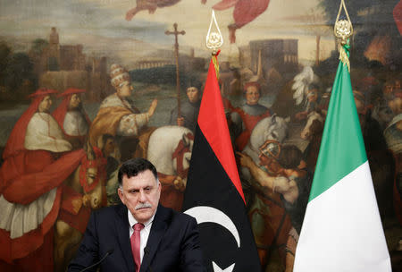 Libyan Prime Minister Fayez al-Sarraj attends a news conference with his Italian counterpart Paolo Gentiloni (not seen) at Chigi Palace in Rome, Italy, July 26, 2017. REUTERS/Max Rossi