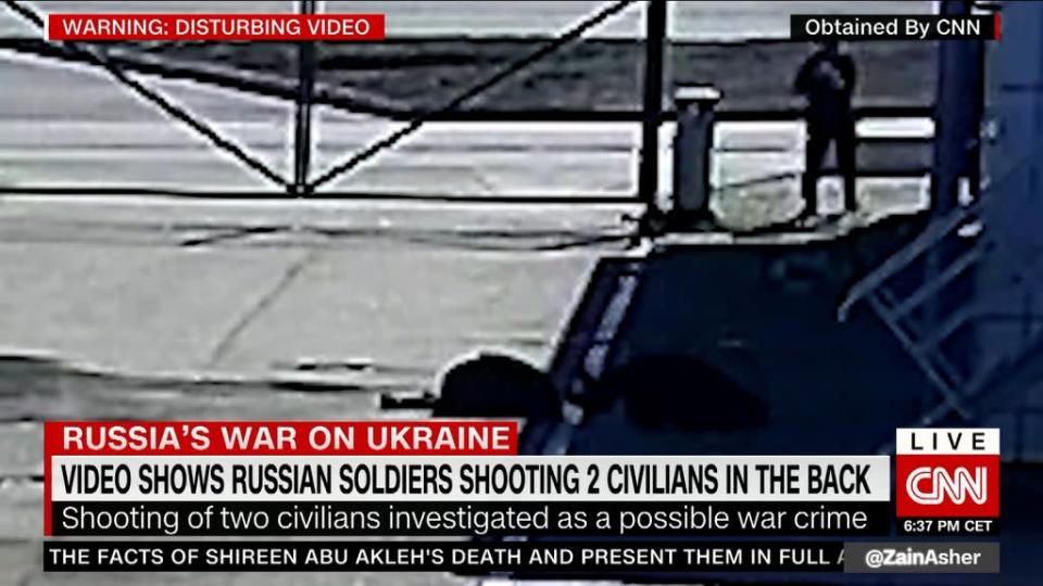 The victims lie on the ground after being shot in the back (CNN)